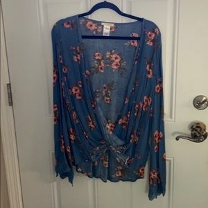 Long wide sleeved blouse.